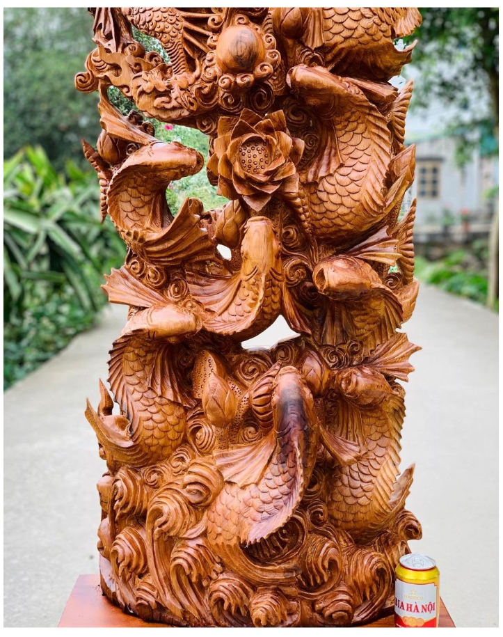 Tượng gỗ Di Lặc Ngự Cá Hóa Long.png